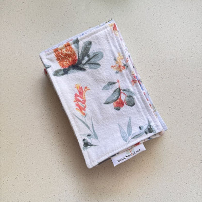 Floral patterned fabric on a beige surface
