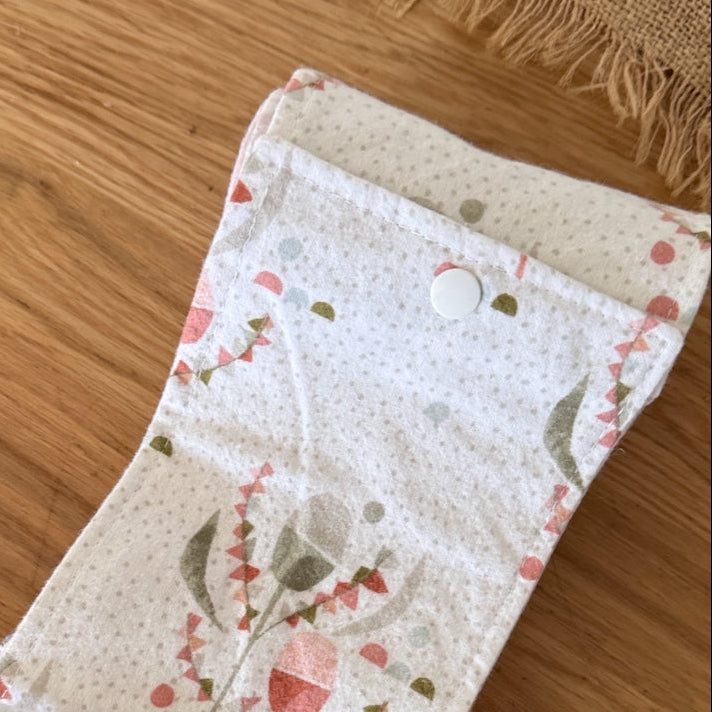 Floral-patterned fabric strip on a wooden surface